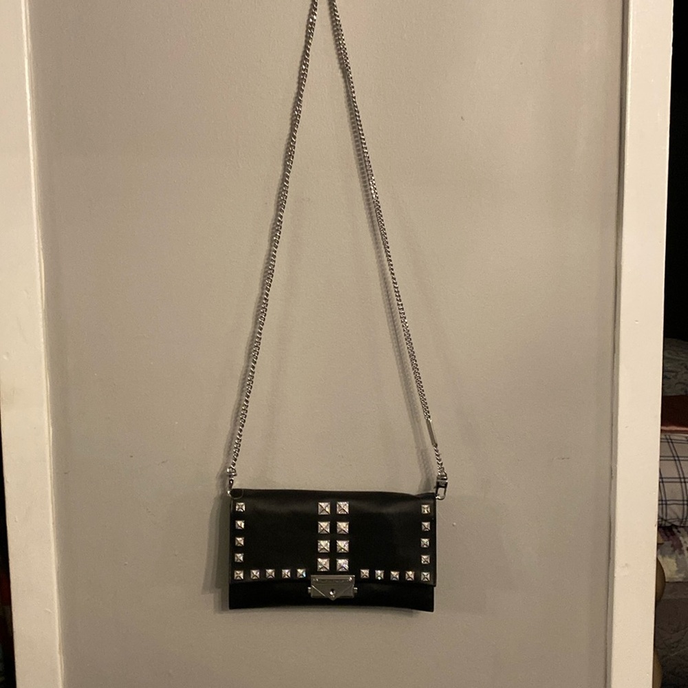 Michael Kors brand new bag can be used as a clutch or on the arm